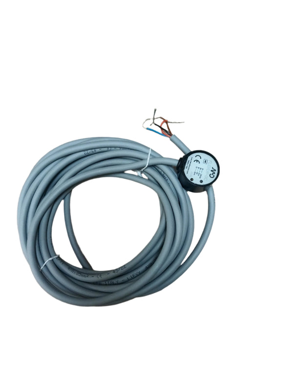 Coiled gray industrial sensor cable with exposed wires and a black circular sensor head labeled FLID DP-0C
