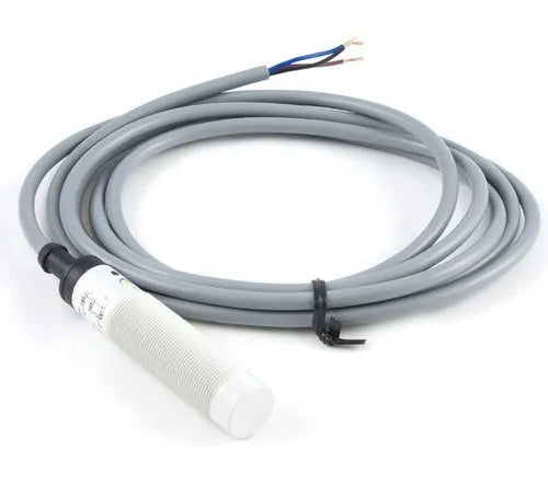 Industrial cylindrical sensor with long gray cable and exposed wires for manufacturing automation