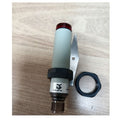 FARL/BP-0E industrial sensor with red top, threaded body, mounting ring, and metal bracket on wood surface